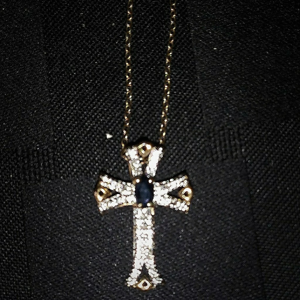 Gold, diamonds, blue sapphire cross necklace